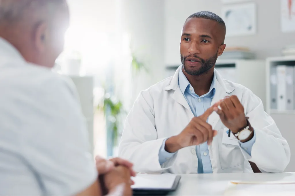 black american hearing specialist gets to know his new patient with recently diagnosed hearing loss